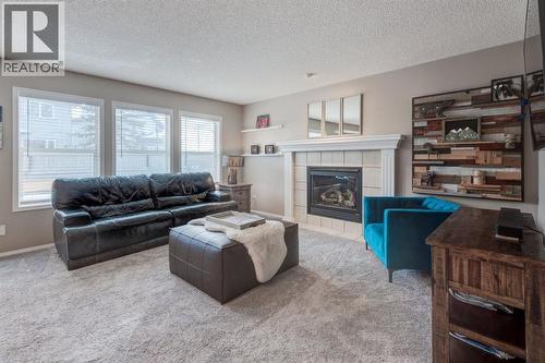 162 Somerside Crescent Sw, Calgary, AB - Indoor Photo Showing Living Room With Fireplace