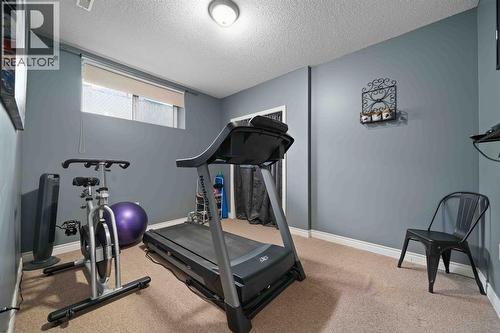 110 Redcliff Way Sw, Redcliff, AB - Indoor Photo Showing Gym Room