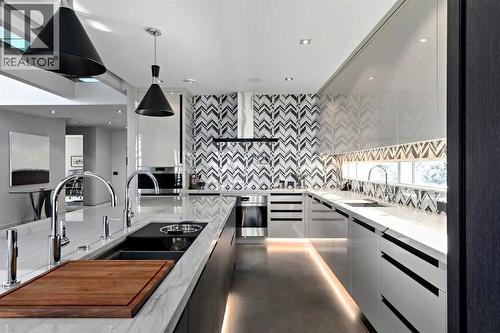 25 Posthill Drive Sw, Calgary, AB - Indoor Photo Showing Kitchen With Double Sink With Upgraded Kitchen