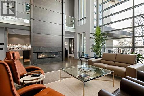 25 Posthill Drive Sw, Calgary, AB - Indoor Photo Showing Living Room