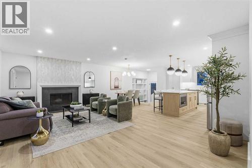 4904 Valiant Drive Nw, Calgary, AB - Indoor Photo Showing Living Room With Fireplace