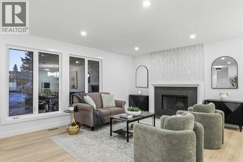 4904 Valiant Drive Nw, Calgary, AB - Indoor Photo Showing Living Room With Fireplace