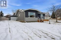 Long driveway leading to the detached garage provides additional parking options - 