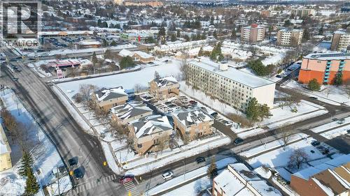 At the corner of River Rd E & Ottawa St N, you're close to so many amenities; Dollarama, McDonald's, Pizza Pizza, M&M Foods, gas stations, highway access, and more! - 12 Holborn Drive Unit# E33, Kitchener, ON - Outdoor With View