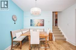 Dining room with wood finished floors and stairs - 