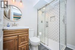 Bathroom featuring vanity and a shower stall - 