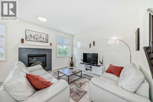 437 Auburn Bay Drive Se, Calgary, AB - Indoor Photo Showing Living Room With Fireplace