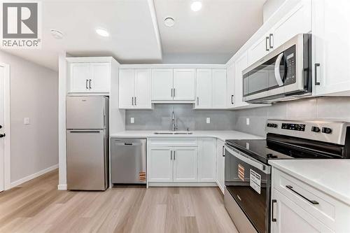 32 Creekview Common Sw, Calgary, AB - Indoor Photo Showing Kitchen With Stainless Steel Kitchen With Upgraded Kitchen