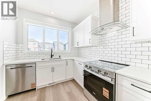 32 Creekview Common Sw, Calgary, AB - Indoor Photo Showing Kitchen With Stainless Steel Kitchen With Upgraded Kitchen