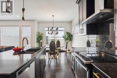86 Creekside Way Sw, Calgary, AB - Indoor Photo Showing Kitchen With Stainless Steel Kitchen With Double Sink With Upgraded Kitchen