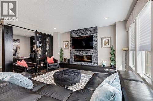 278 Legacy View Se, Calgary, AB - Indoor Photo Showing Living Room With Fireplace