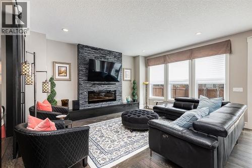 278 Legacy View Se, Calgary, AB - Indoor Photo Showing Living Room With Fireplace