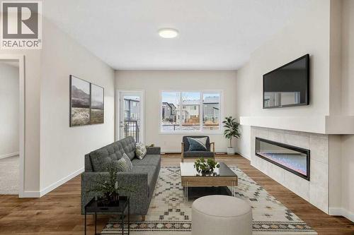 136 Wolf Hollow Manor Se, Calgary, AB - Indoor Photo Showing Living Room With Fireplace