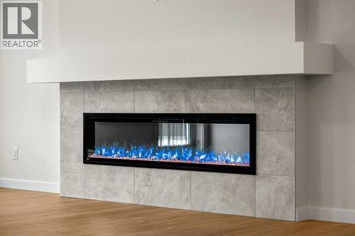 136 Wolf Hollow Manor Se, Calgary, AB - Indoor With Fireplace