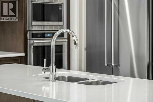 136 Wolf Hollow Manor Se, Calgary, AB - Indoor Photo Showing Kitchen With Double Sink