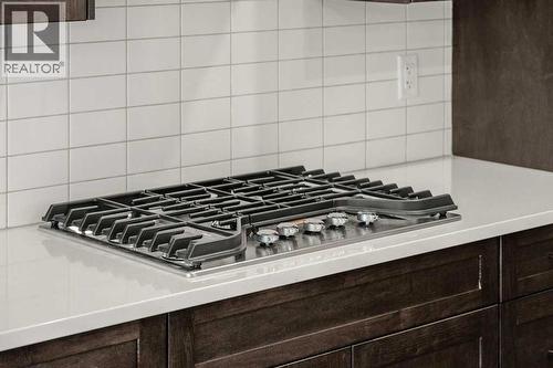 136 Wolf Hollow Manor Se, Calgary, AB - Indoor Photo Showing Kitchen With Upgraded Kitchen