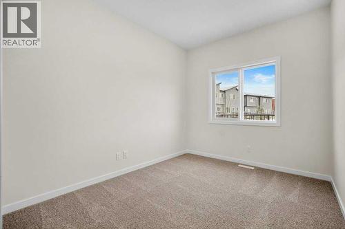 Main floor flexbedroom room or - 136 Wolf Hollow Manor Se, Calgary, AB - Indoor Photo Showing Other Room