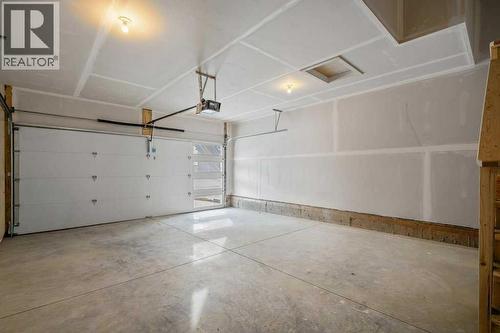 136 Wolf Hollow Manor Se, Calgary, AB - Indoor Photo Showing Garage