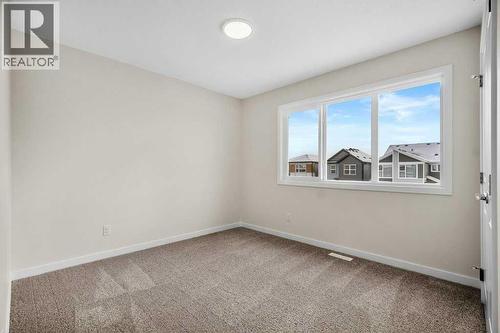 136 Wolf Hollow Manor Se, Calgary, AB - Indoor Photo Showing Other Room