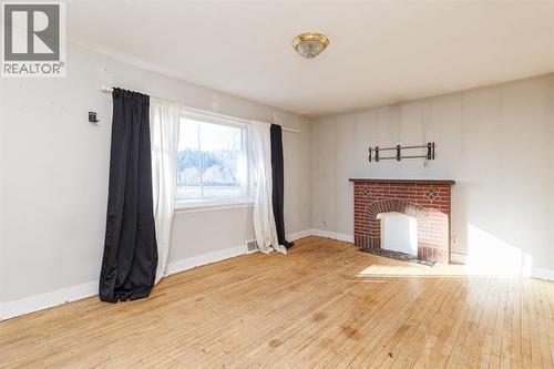 2820 Parkdale Boulevard Nw, Calgary, AB - Indoor Photo Showing Other Room With Fireplace