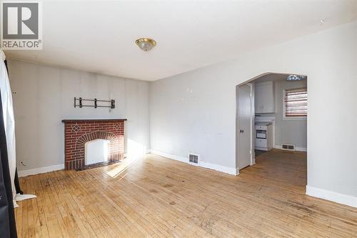 2820 Parkdale Boulevard Nw, Calgary, AB - Indoor Photo Showing Other Room With Fireplace