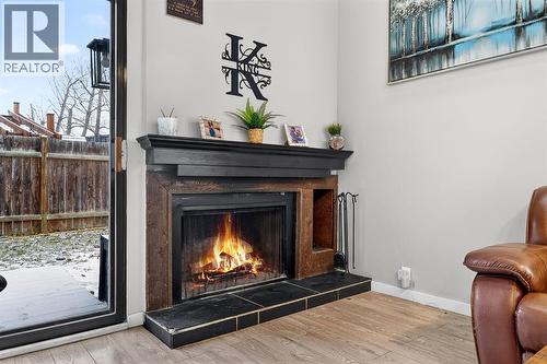 941 Ranchview Crescent Nw, Calgary, AB - Indoor Photo Showing Living Room With Fireplace