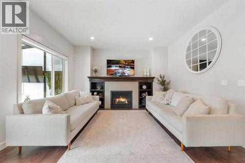 35 Aspenshire Drive Sw, Calgary, AB - Indoor Photo Showing Living Room With Fireplace