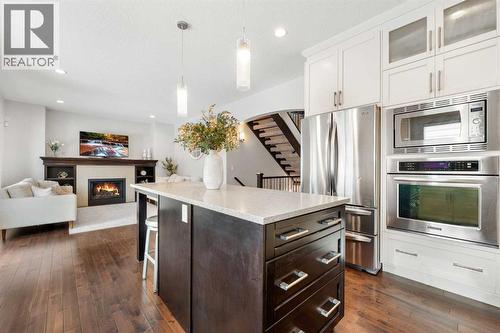35 Aspenshire Drive Sw, Calgary, AB - Indoor Photo Showing Kitchen With Fireplace With Upgraded Kitchen