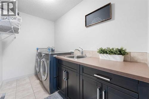 35 Aspenshire Drive Sw, Calgary, AB - Indoor Photo Showing Laundry Room