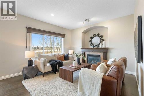 100 Lakeside View, Strathmore, AB - Indoor Photo Showing Living Room With Fireplace