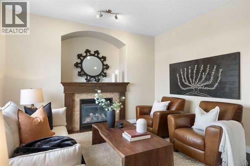 100 Lakeside View, Strathmore, AB - Indoor Photo Showing Living Room With Fireplace