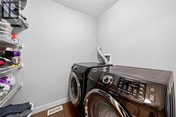 Upper-floor laundry with built-in storage - 