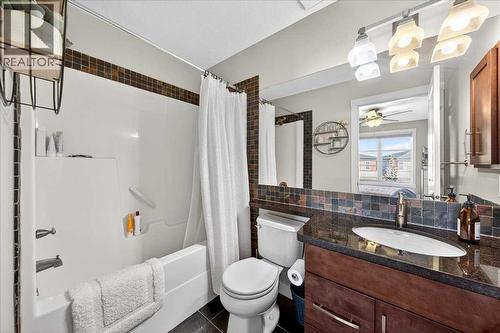Second bedroom ensuite with stone counter and tub/shower with tile surround - 37 Aspen Hills Terrace Sw, Calgary, AB - Indoor Photo Showing Bathroom