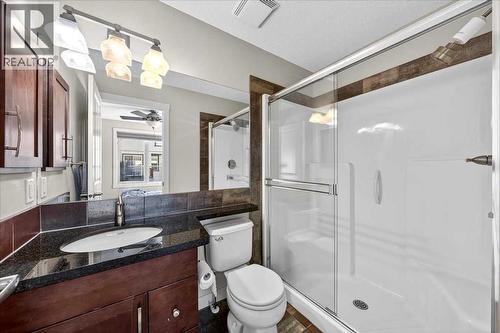 Primary ensuite with stone vanity and glass-enclosed shower - 37 Aspen Hills Terrace Sw, Calgary, AB - Indoor Photo Showing Bathroom