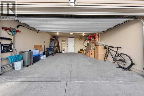 Double attached garage with room for vehicles, storage, and gear - 37 Aspen Hills Terrace Sw, Calgary, AB - Indoor Photo Showing Garage