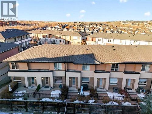Front of the townhome building, aerial view - 37 Aspen Hills Terrace Sw, Calgary, AB - Outdoor With Facade