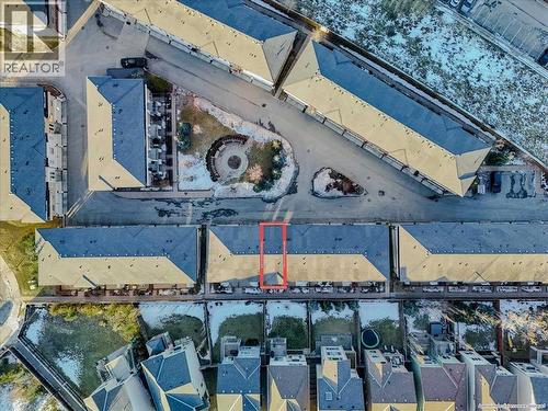 Aerial view showing 37 Aspen Hills Terrace SW outlined in red - 37 Aspen Hills Terrace Sw, Calgary, AB -  With View