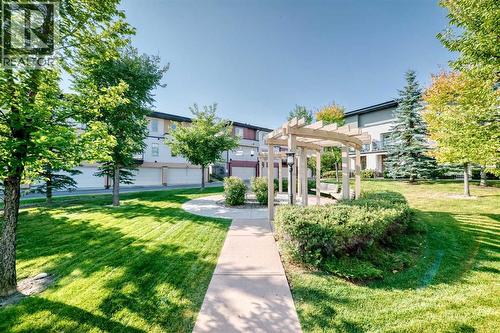 Outdoor common area shown in summer. An extension of the neighbourhood, not just a pass-through - 37 Aspen Hills Terrace Sw, Calgary, AB - Outdoor
