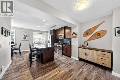 Kitchen view with large window and natural light beyond - 37 Aspen Hills Terrace Sw, Calgary, AB - Indoor Photo Showing Kitchen