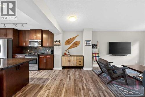 Seamless flow between the kitchen and living room - 37 Aspen Hills Terrace Sw, Calgary, AB - Indoor Photo Showing Kitchen