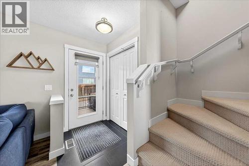 Front entry with coat closet and access to the upper level - 37 Aspen Hills Terrace Sw, Calgary, AB - Indoor Photo Showing Other Room