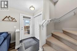 Front entry with coat closet and access to the upper level - 