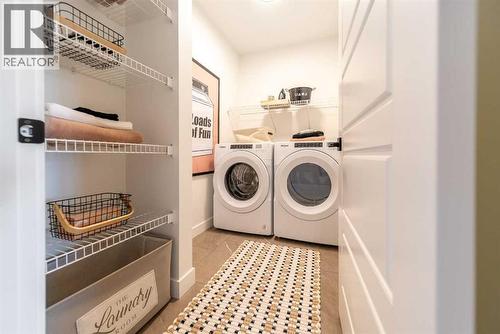 211 Langwell Common Se, Airdrie, AB - Indoor Photo Showing Laundry Room