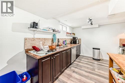 176 Hendon Drive Nw, Calgary, AB - Indoor Photo Showing Kitchen With Double Sink