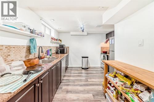 176 Hendon Drive Nw, Calgary, AB - Indoor Photo Showing Kitchen With Double Sink