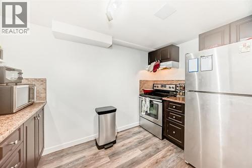 176 Hendon Drive Nw, Calgary, AB - Indoor Photo Showing Kitchen With Stainless Steel Kitchen