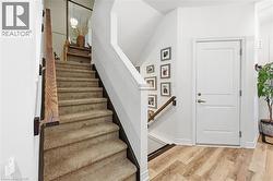 Stairs featuring wood finished floors - 
