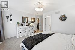 Bedroom with light colored carpet - 