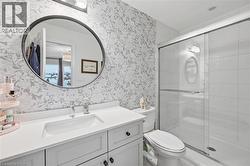 Full bathroom with vanity and a shower stall - 