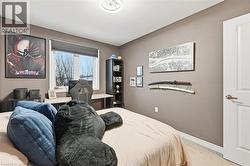 Carpeted bedroom featuring baseboards - 